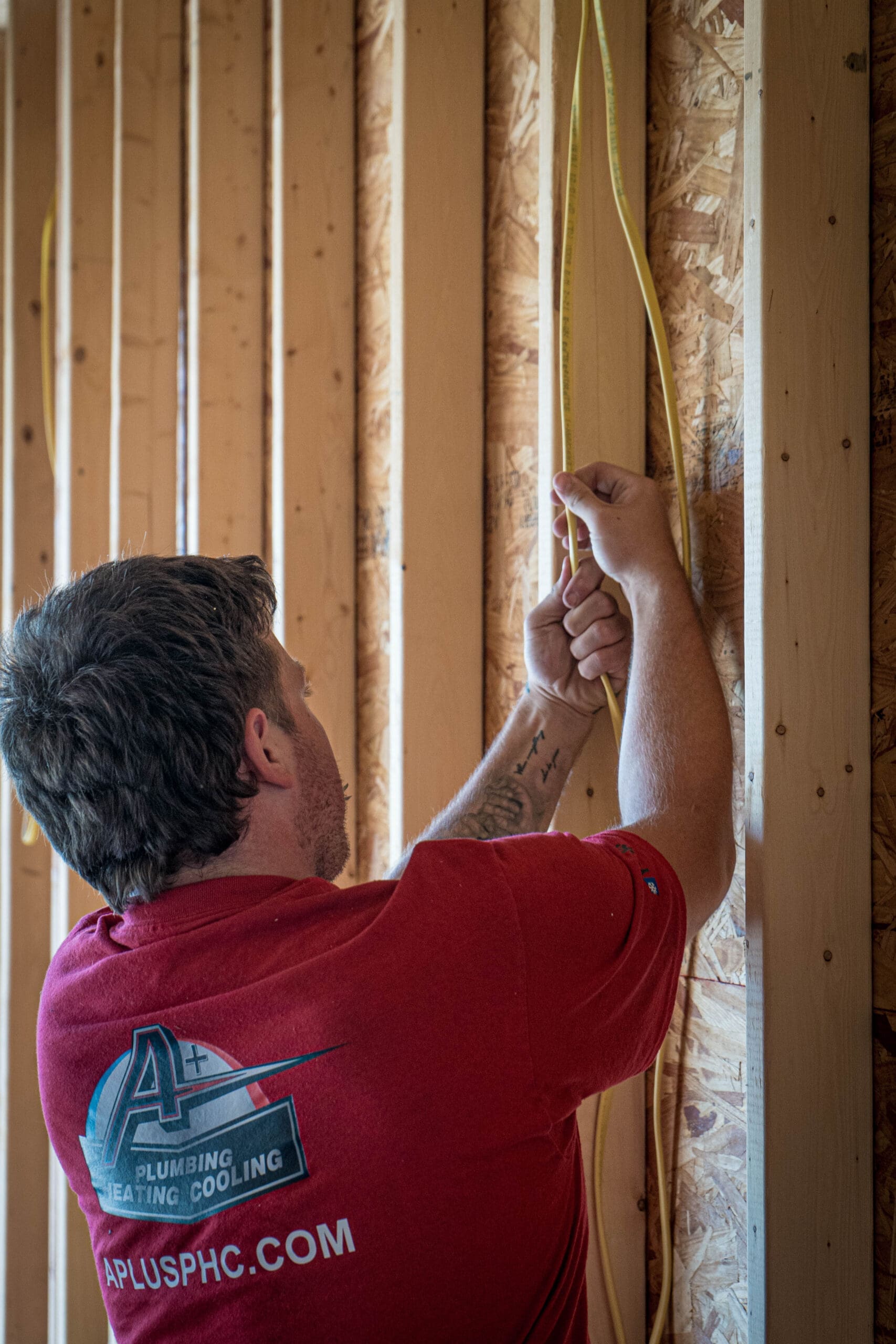 Technician installing electrical wiring